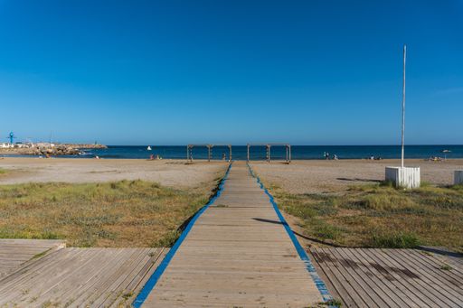 A wooden walkway to San Jose beach in the town of Nijar, Almeria. Andalusian coast in Cabo de Gata. Spain