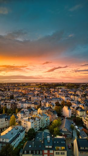 Aerial view of a French city skyline at sunset, taken from the top of a tall tower