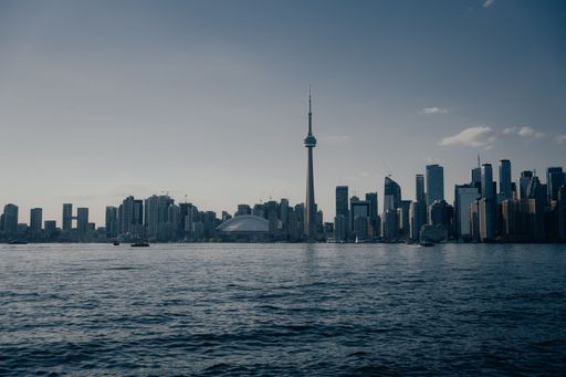 This stunning image showcases the skyline of a picturesque city, captured from across its tranquil waters