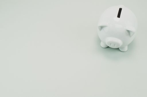 A grayscale shot of a piggy bank
