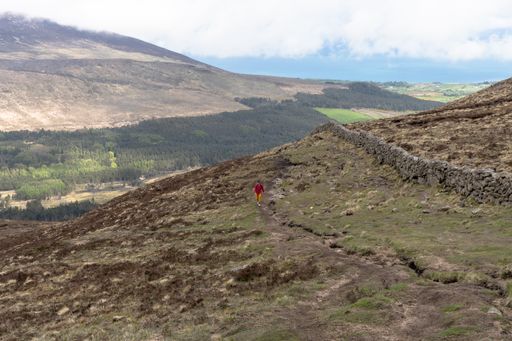 A caucasian woman hiking in Slieve Binnian Mountains, North Ireland