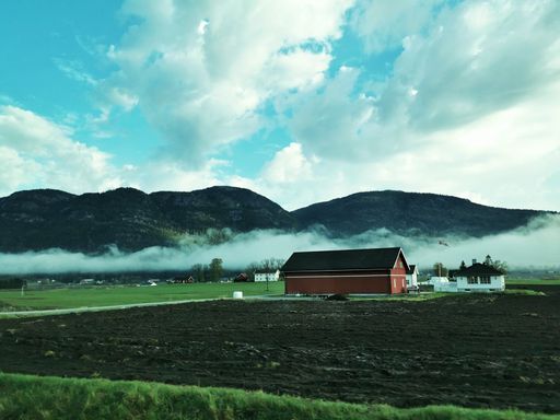 A beautiful country landscape with mountain under a cloudy sky in the Vestfold region of Norway