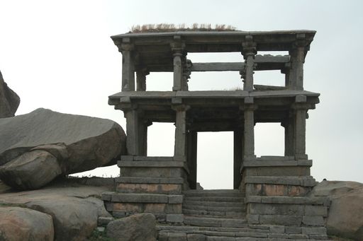 A pillared stone entrance and viewing gallery at Hemakoota Temples Hill, Hampi, Karnataka, India