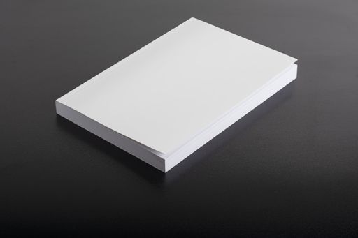 A book with a blank cover in the black background, editable mock-up template ready for design, selection path included