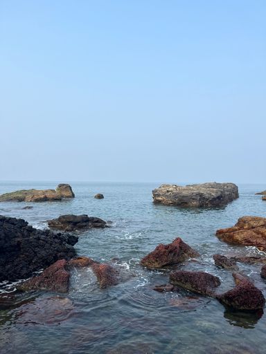 An idyllic landscape of a small tropical island surrounded by crystal blue waters