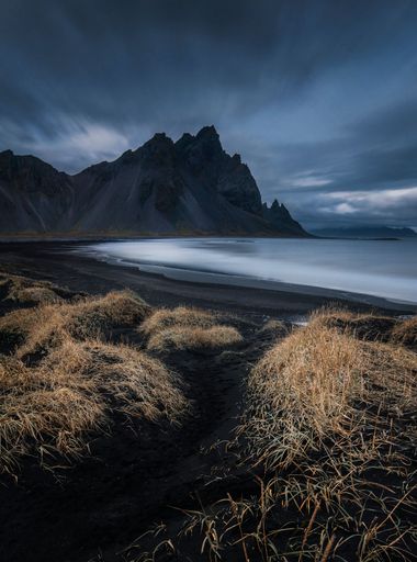 A scenic view of Vestrahorn in Iceland on a gloomy day
