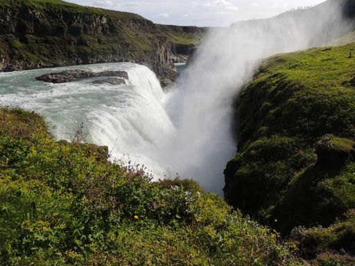 A beautiful view of the Gullfoss Falls under the cloudy blue sky in Iceland