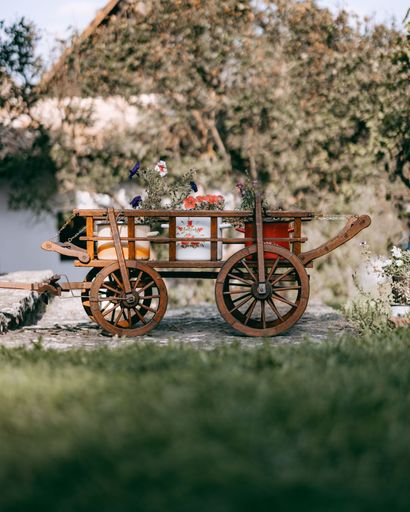 A wooden carriage with flowers in Holloko village, northern Hungary, in Nograd County