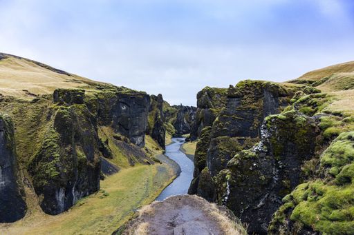 A panoramic shot of the Fjadrargljufur canyon in Kirkjubaejarklaustur, Iceland on a bright sunny day