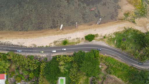 Aerial view of an island featuring winding roads meandering through the surrounding waters