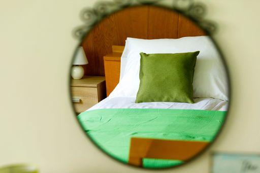 An interior of a green bedroom design