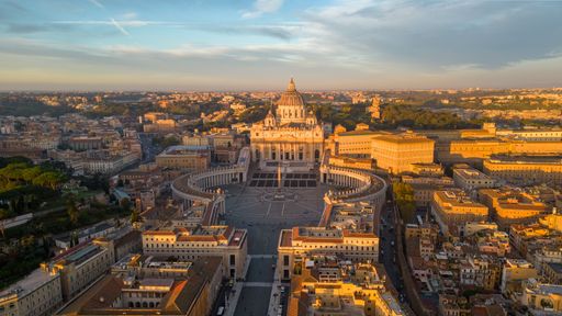 Saint Peter's Square and Basilica in Vatican City, Vatican at Sunrise. Incredible Aerial Drone View