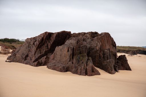The rocks on the sandy ground with a grey background