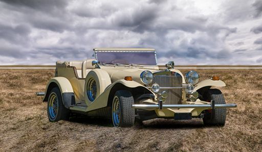 A spectacular view of a classic Excalibur automobile in a field on a cloudy sky background
