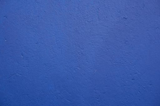 A rugged concrete texture in blue color for wallpaper or background