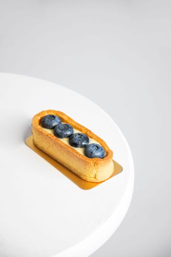 A closeup shot of a delicious tart with blueberries