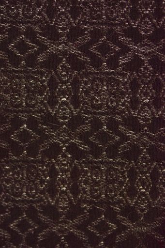 A closeup shot of a piece of wool fabric with various patterns