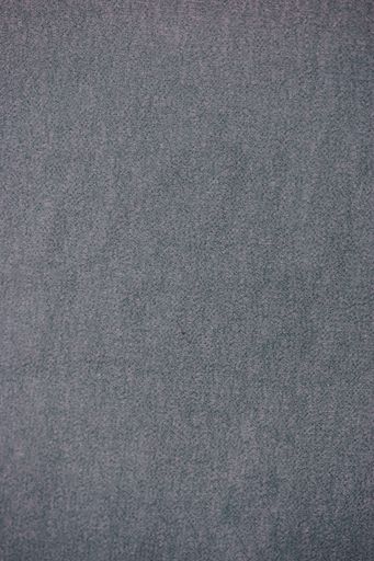 A vertical shot of grey fabric texture