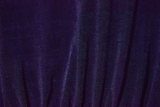 A closeup shot of dark-blue fabric curtain used for wallpaper or background