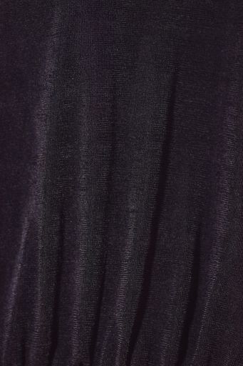 A vertical shot of black corduroy fabric