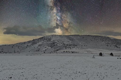 The scenic view of the Milky way over majestic snow mountain