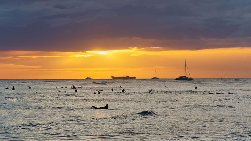 A scenic view of sunset at Waikiki Beach, Honolulu, Hawaii, USA