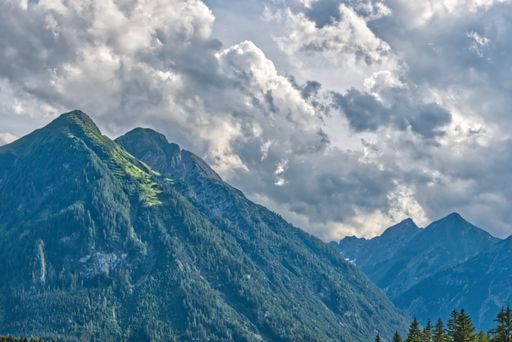 A closeup shot of mountains under a cloudy sky in the Alps, Austria
