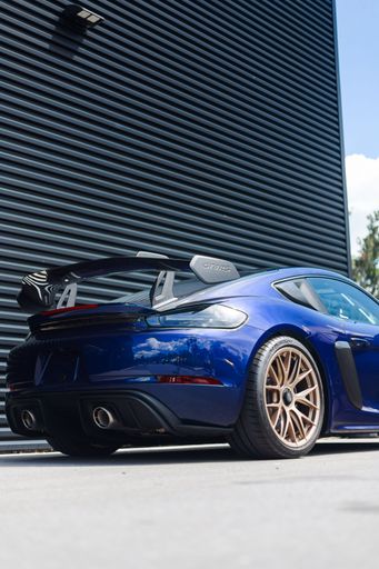 A beautiful brand new Gentian Blue Porsche Cayman GT4 RS waiting to be collected by the new owner and driven to the mountains.