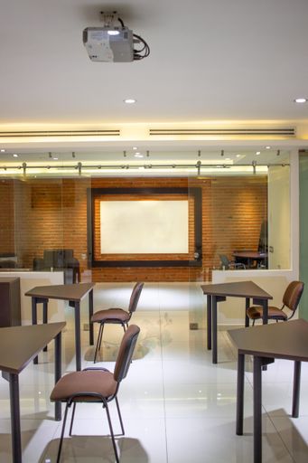 An inside view of a modern conference room with an empty poster for text