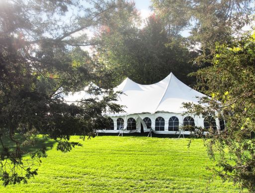 tent set up in the early morning on day of a wedding