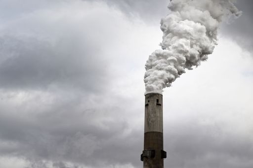 A smoking smokestack billowing noxious smoke