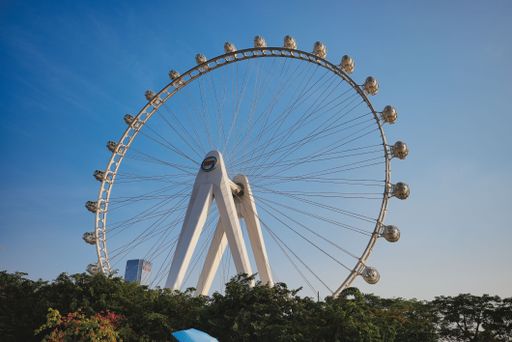 A majestic Ferris wheel on a clear day, illuminated by the sun in Shenzhen, China