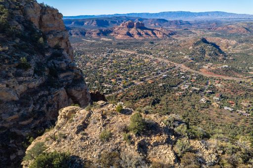 A scenic view of native American ruins overlooking Sedona from a plateau