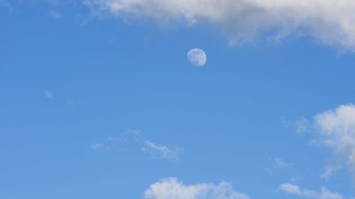 The moon in the blue sky during the daytime perfect for background