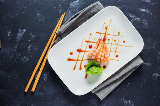 A top view of delicious Japanese shrimps with wasabi and soy sauce on the table