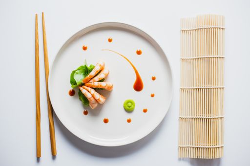 A top view of delicious Japanese shrimps with wasabi and soy sauce on the table