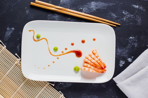 A top view of delicious Japanese shrimps with wasabi and soy sauce on the table
