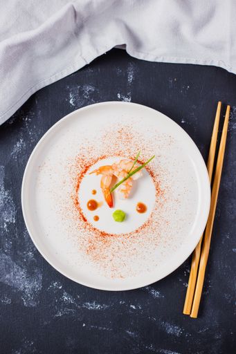 A top view of delicious Japanese shrimps with wasabi and soy sauce on the table