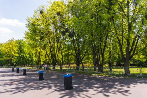 Row of trash containers during the Poznanskie Dni Rodziny event in the Jan Pawla park.