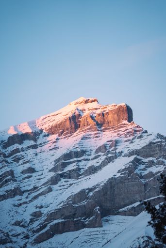 A photo of beautiful snowy mountain with Banff road over sunset