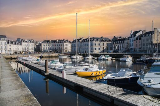 The several boats in the harbor of Vannes, a medieval city in Brittany at sunset