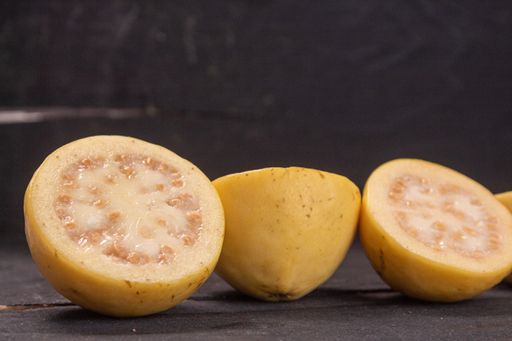 A closeup shot of cut lemon on dark background