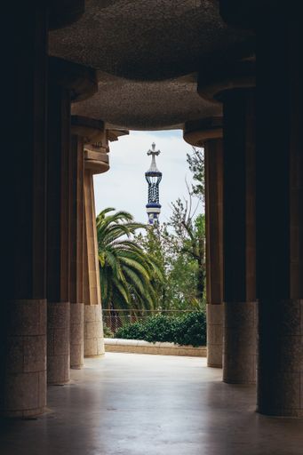 A vertical shot of the architecture and nature in Park Guell in Barcelona Spain