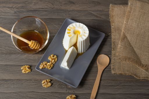 fresh cheese with honey and walnuts with different containers and backgrounds