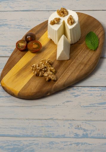 fresh cheese with honey and walnuts with different containers and backgrounds