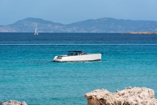 Formentera, Spain: 2021 My 26: Boats moored on the coast of Ses Illetes beach in Formentera, Balearic Islands in Spain.
