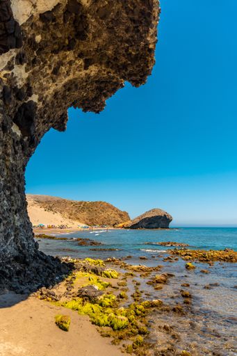 A vertical shot of eroded lava formations in Monsul beach in Almeria, Spain