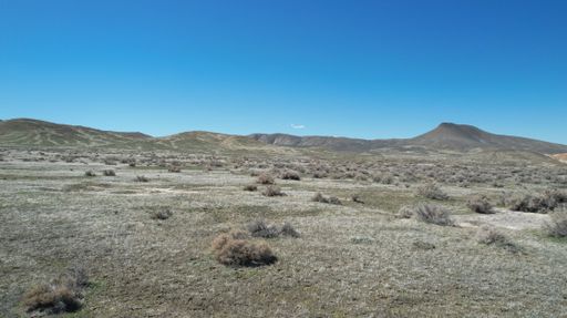An aerial view of the Nevada desert in the northwest Winnemucca area against a vivid blue sky