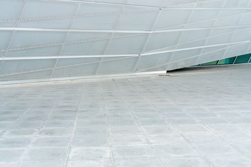 empty marble floor in front of building exterior for copy space.