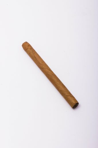 A vertical shot of one piece of cigar on an isolated background